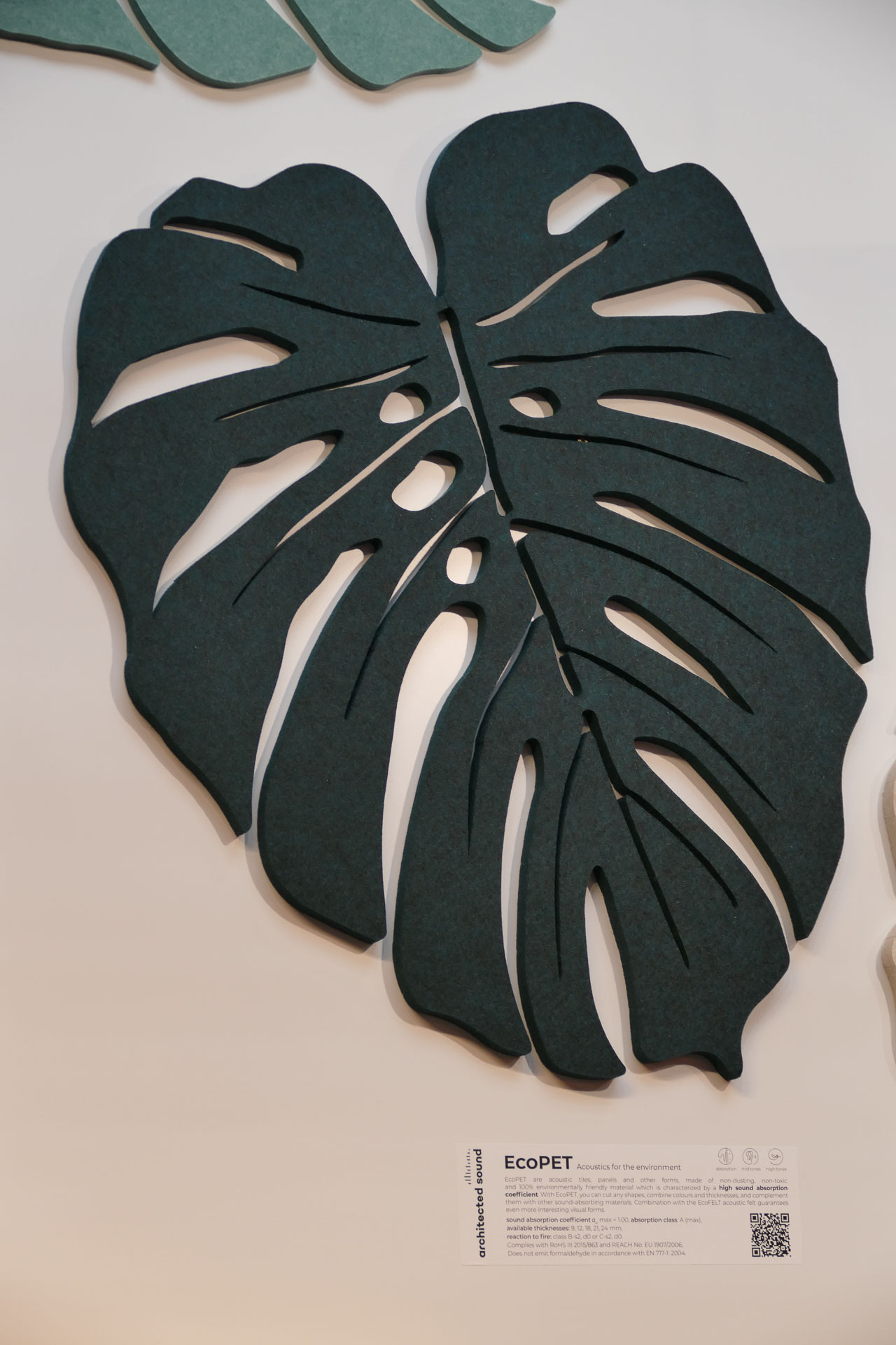 Sound absorbing wall cladding in monstera leaf shape